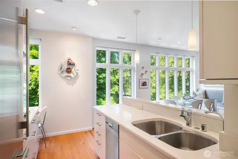 a kitchen with a sink and a refrigerator