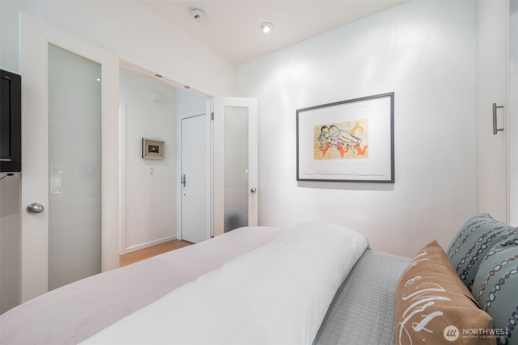 3601 South McClellan Street, Unit 8 Seattle, WA 98144 - Photo 19 of 23 a bedroom with a bed and a painting on the wall