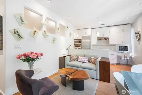 a living room with furniture and flowers