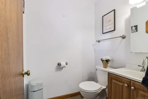 a white toilet sitting next to a bathroom sink
