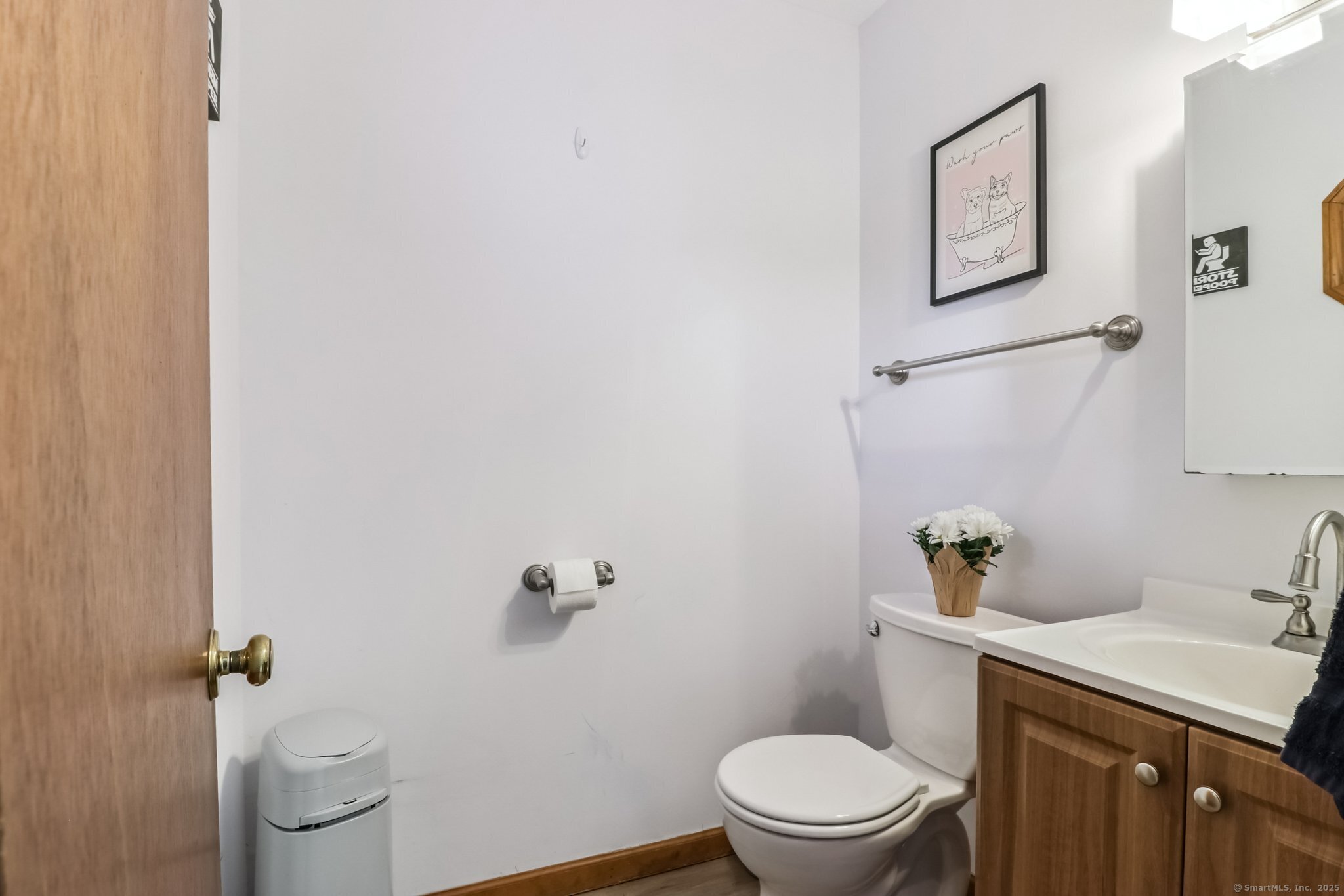 565 Clark Avenue, Unit 18 Bristol, CT 06010 - Photo 6 of 25 a white toilet sitting next to a bathroom sink