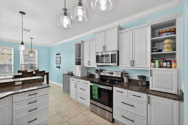 a bedroom with bed and window with lamp