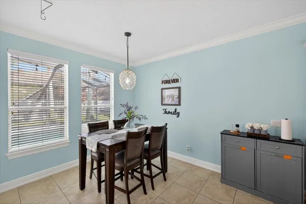 a bedroom with a bed and a ceiling fan