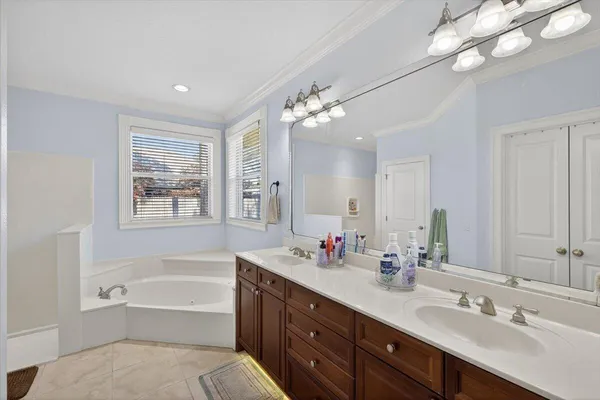 a bedroom with furniture and window