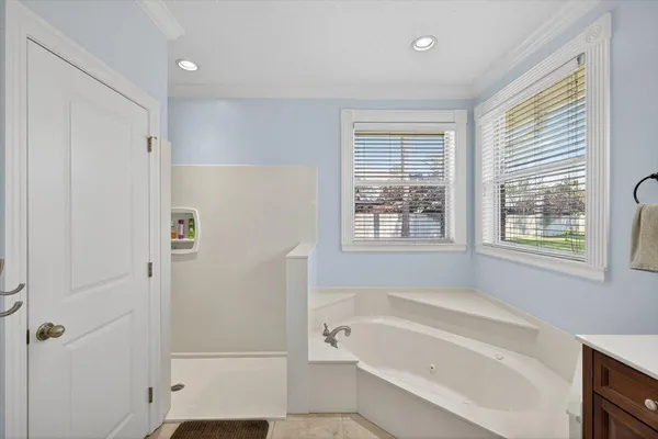a bathroom with a sink vanity mirror and toilet