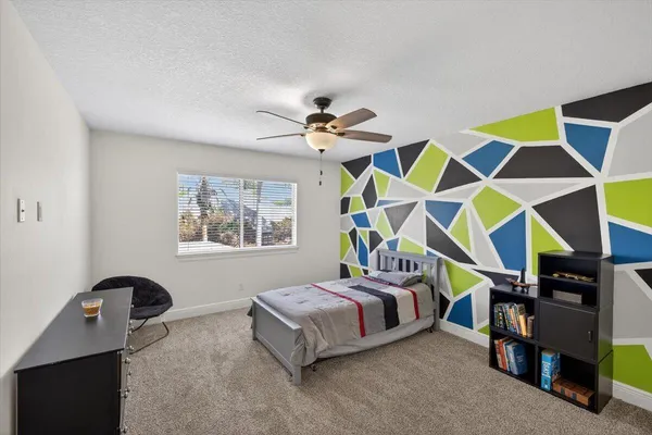 a living room with lots of furniture and a window