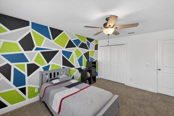 a bedroom with furniture and a window