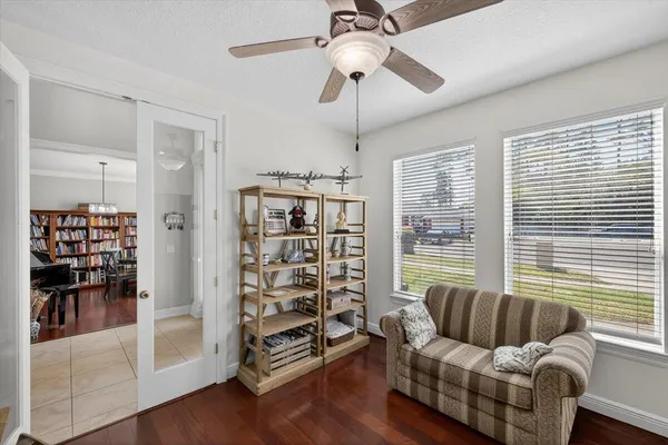 a view of a workspace with furniture and wooden floor