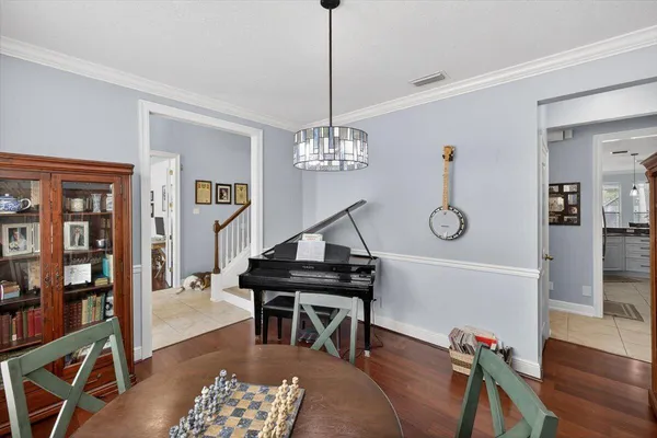 a living room with fireplace furniture and a flat screen tv