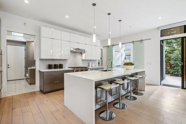 a kitchen with a sink and a refrigerator