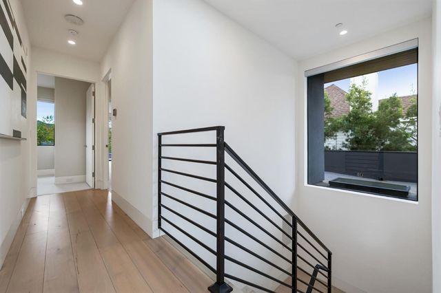 a bedroom with a bed and a lamp on table