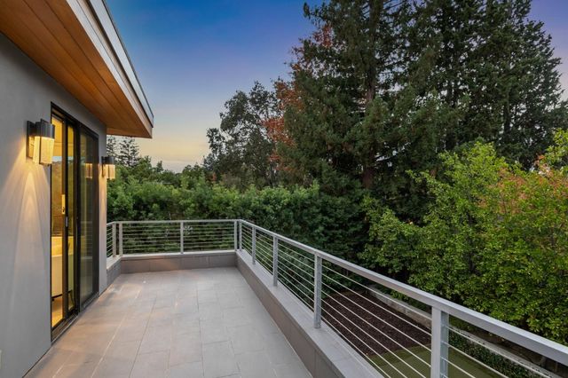 a bathroom with a tub sink shower and mirror