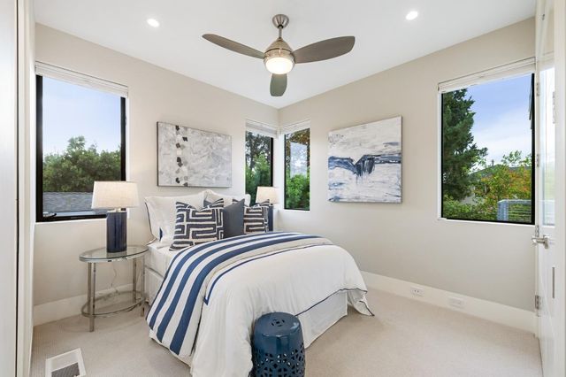 a bathroom with a double vanity sink mirror and shower