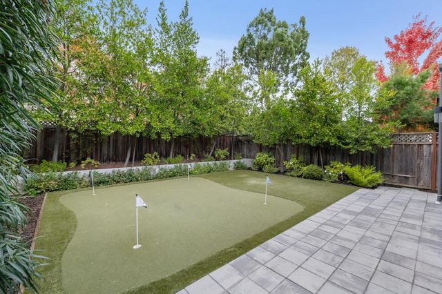 a balcony view with a seating space