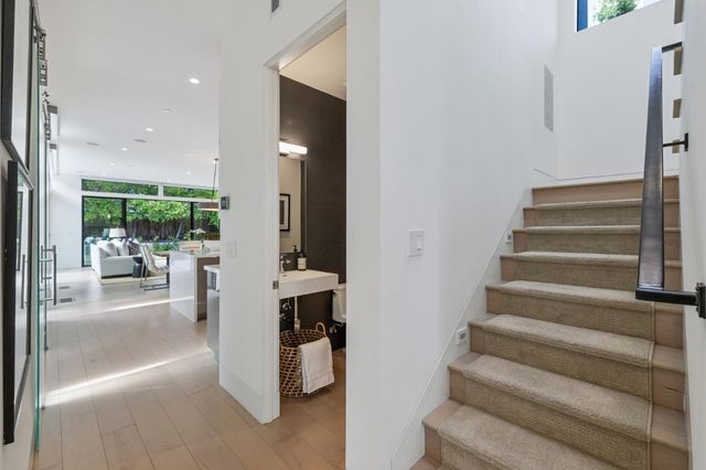 a view of entryway and hall with dining room