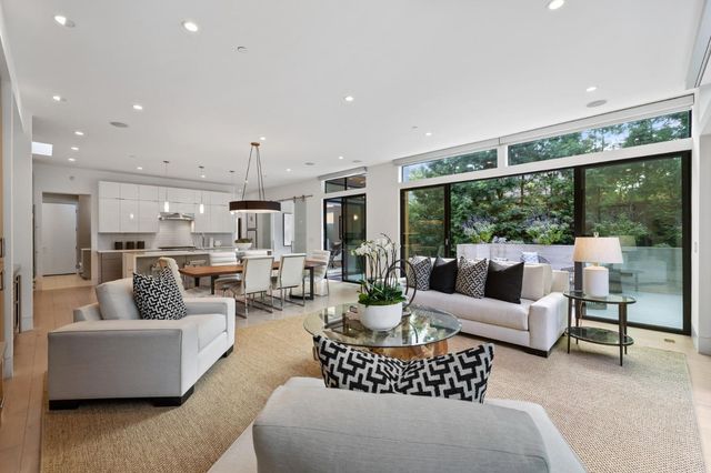 a dining room with furniture window and outdoor view