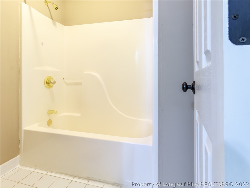 6915 Surrey Road Fayetteville, NC 28306 - Photo 12 of 37 a bathroom with a bathtub