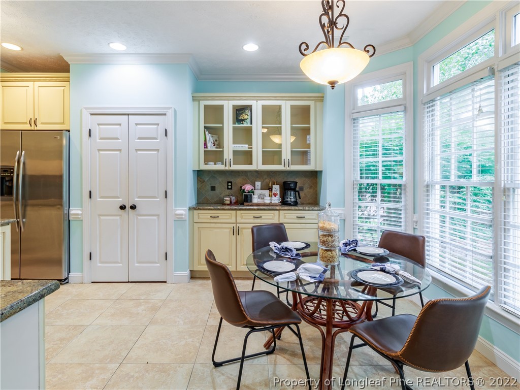 6915 Surrey Road Fayetteville, NC 28306 - Photo 18 of 37 a view of a dining room with furniture window and outside view