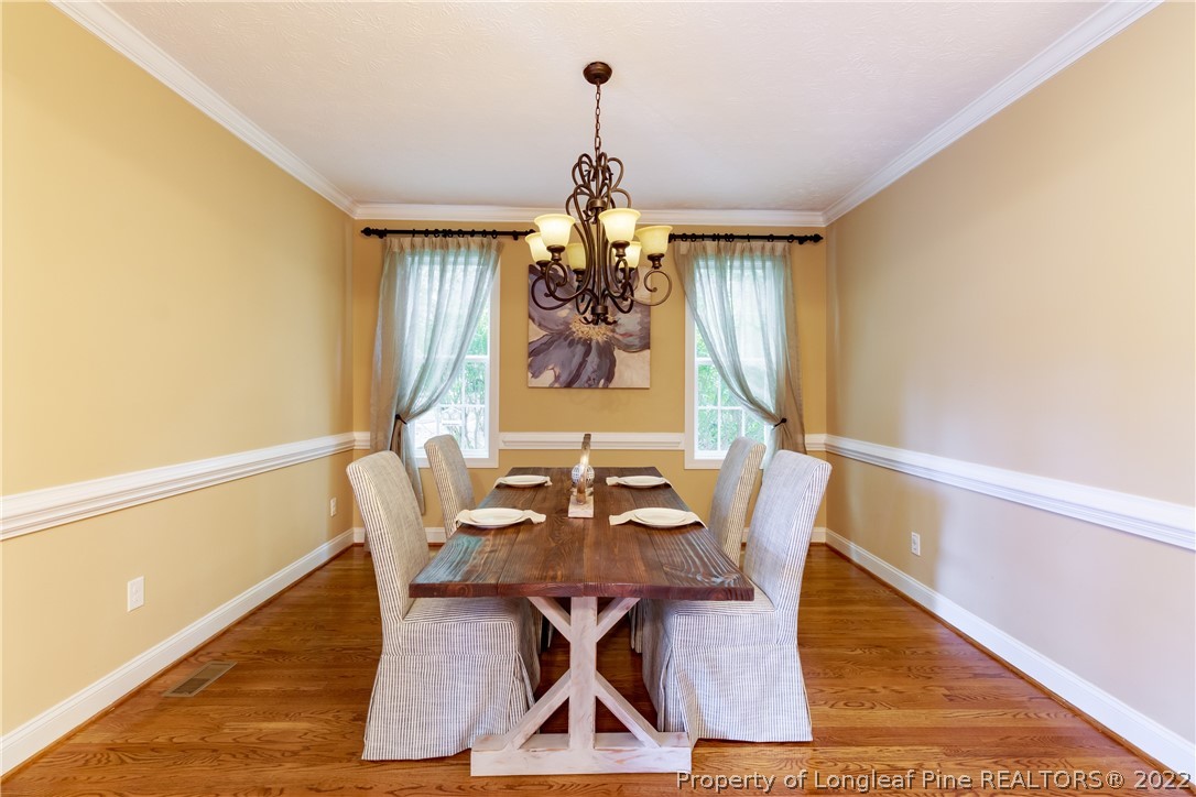 6915 Surrey Road Fayetteville, NC 28306 - Photo 20 of 37 a dining room with furniture and window