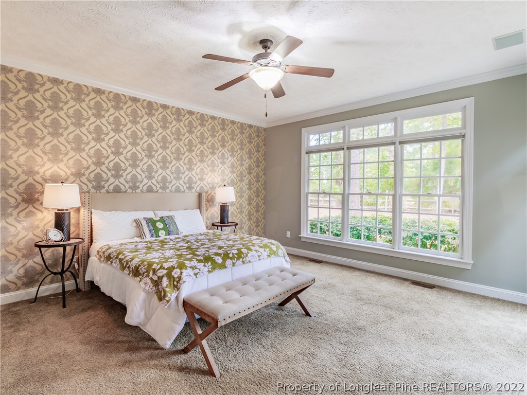 6915 Surrey Road Fayetteville, NC 28306 - Photo 23 of 37 a bedroom with a bed and window