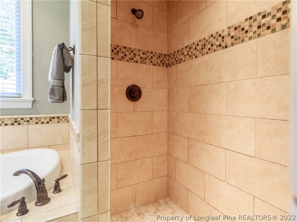 6915 Surrey Road Fayetteville, NC 28306 - Photo 27 of 37 a bathroom with a shower