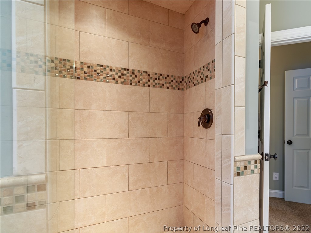 6915 Surrey Road Fayetteville, NC 28306 - Photo 28 of 37 a bathroom with a shower