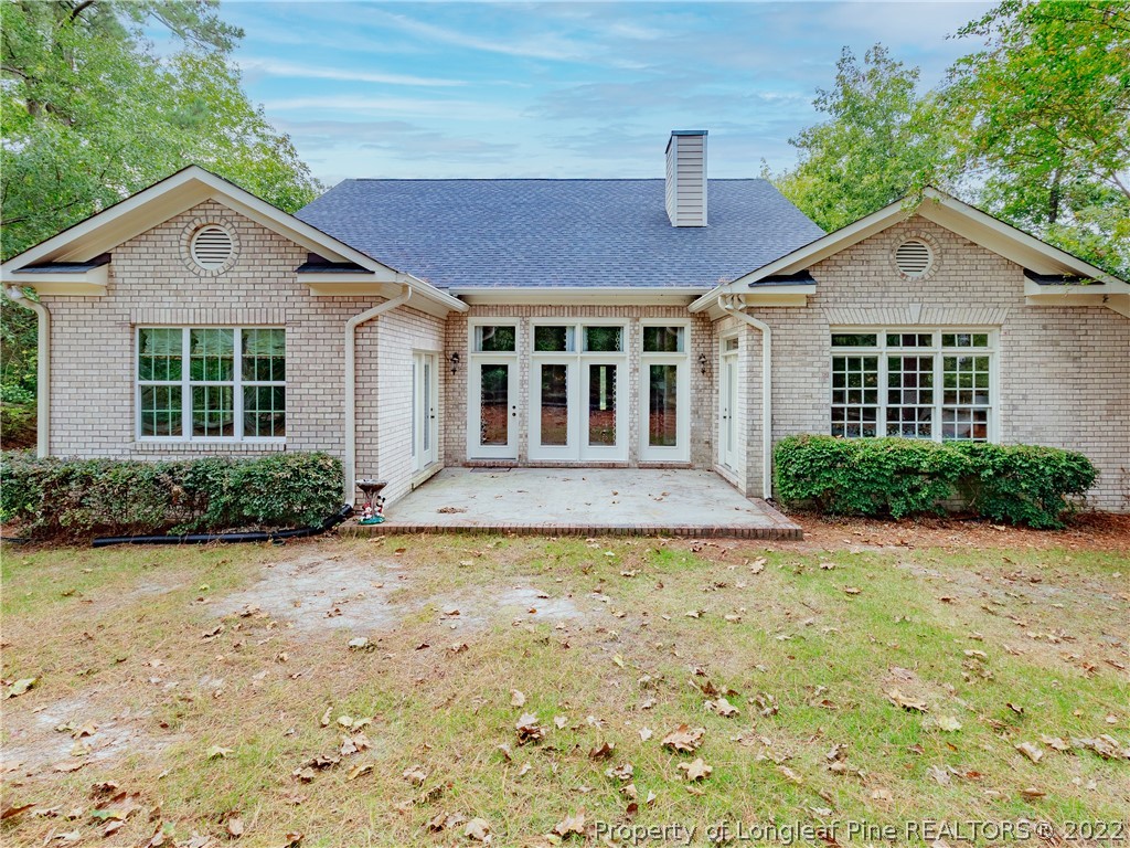 6915 Surrey Road Fayetteville, NC 28306 - Photo 33 of 37 a front view of a house with garden