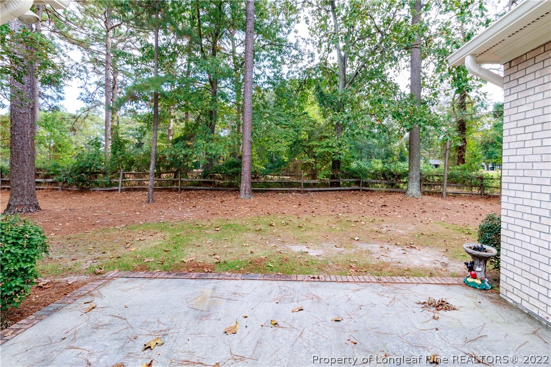 6915 Surrey Road Fayetteville, NC 28306 - Photo 35 of 37 a backyard of a house with lots of green space