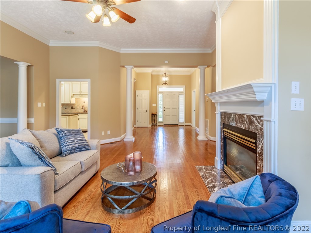 6915 Surrey Road Fayetteville, NC 28306 - Photo 5 of 37 a living room with furniture and a wooden floor