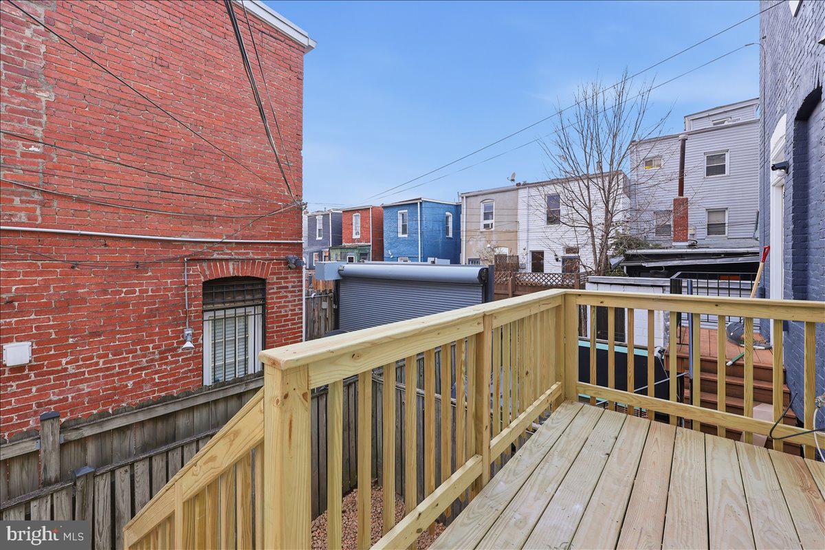 820 13th Street Northeast Washington, DC 20002 - Photo 12 of 38 a view of balcony with wooden floor and fence
