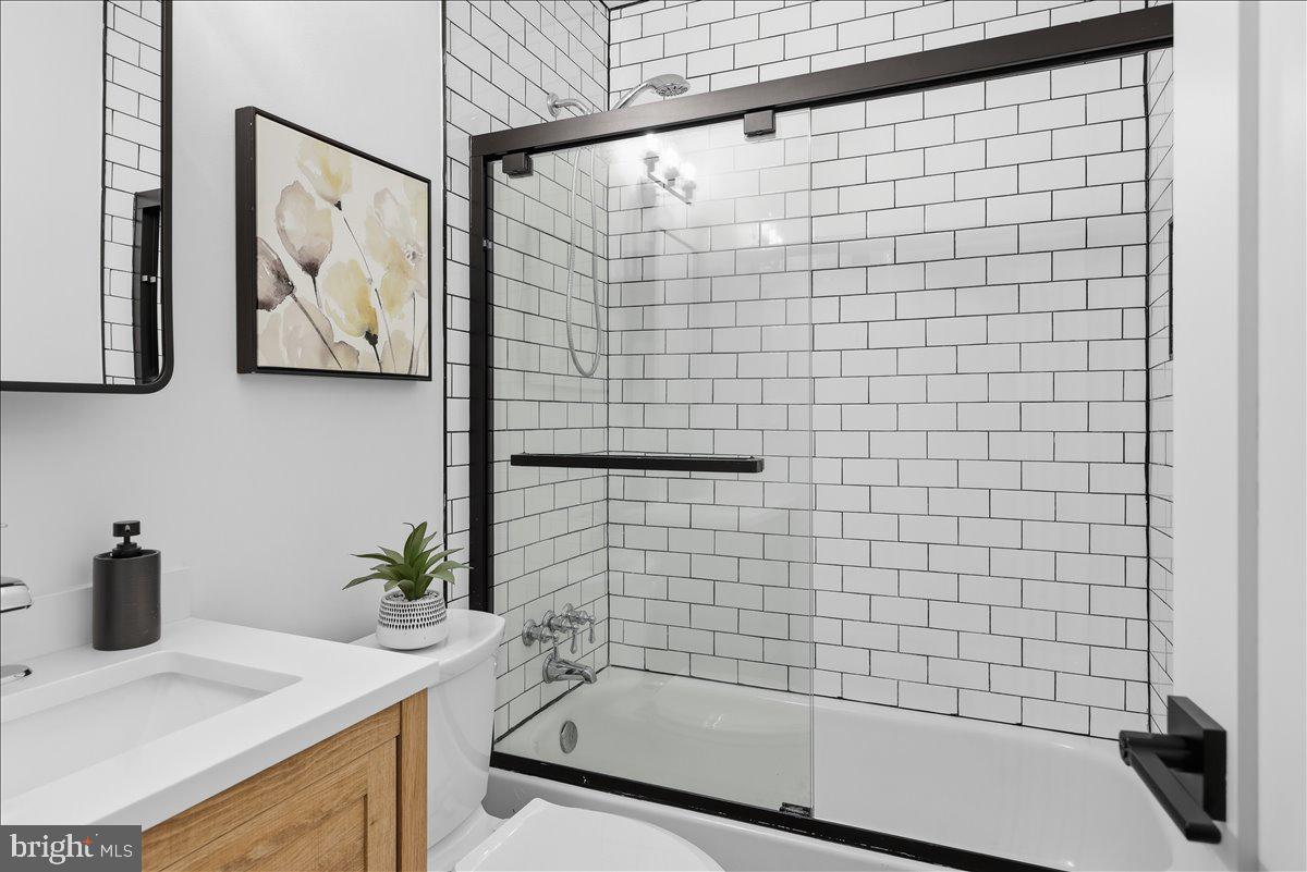 820 13th Street Northeast Washington, DC 20002 - Photo 16 of 38 a bathroom with a sink a bathtub and shower