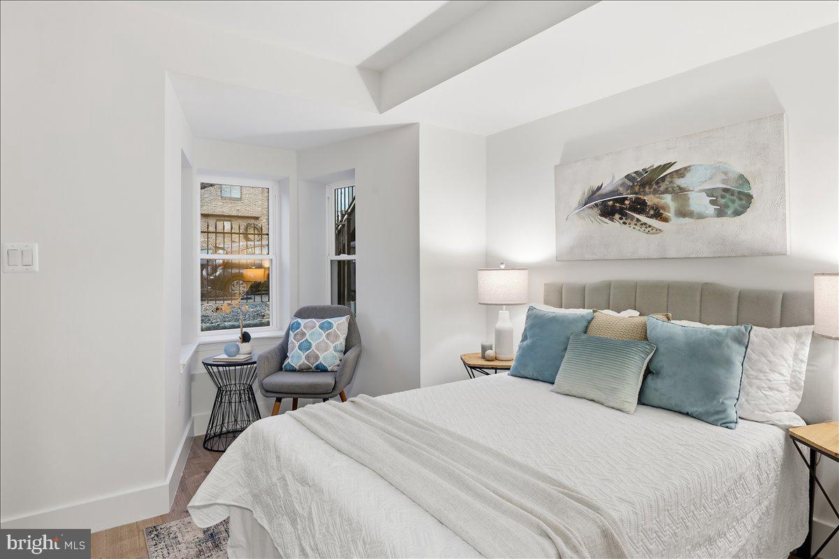 820 13th Street Northeast Washington, DC 20002 - Photo 21 of 38 a bedroom with a bed and a table in it