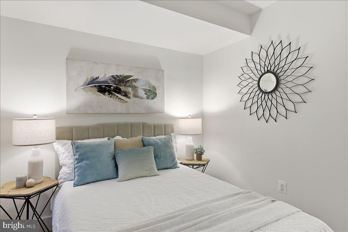 820 13th Street Northeast Washington, DC 20002 - Photo 22 of 38 a bedroom with a bed and a couch