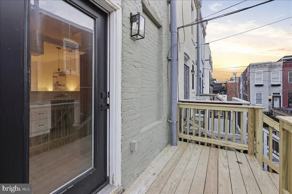 a view of balcony with wooden floor