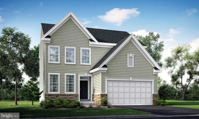 a view of a house with a yard and potted plants