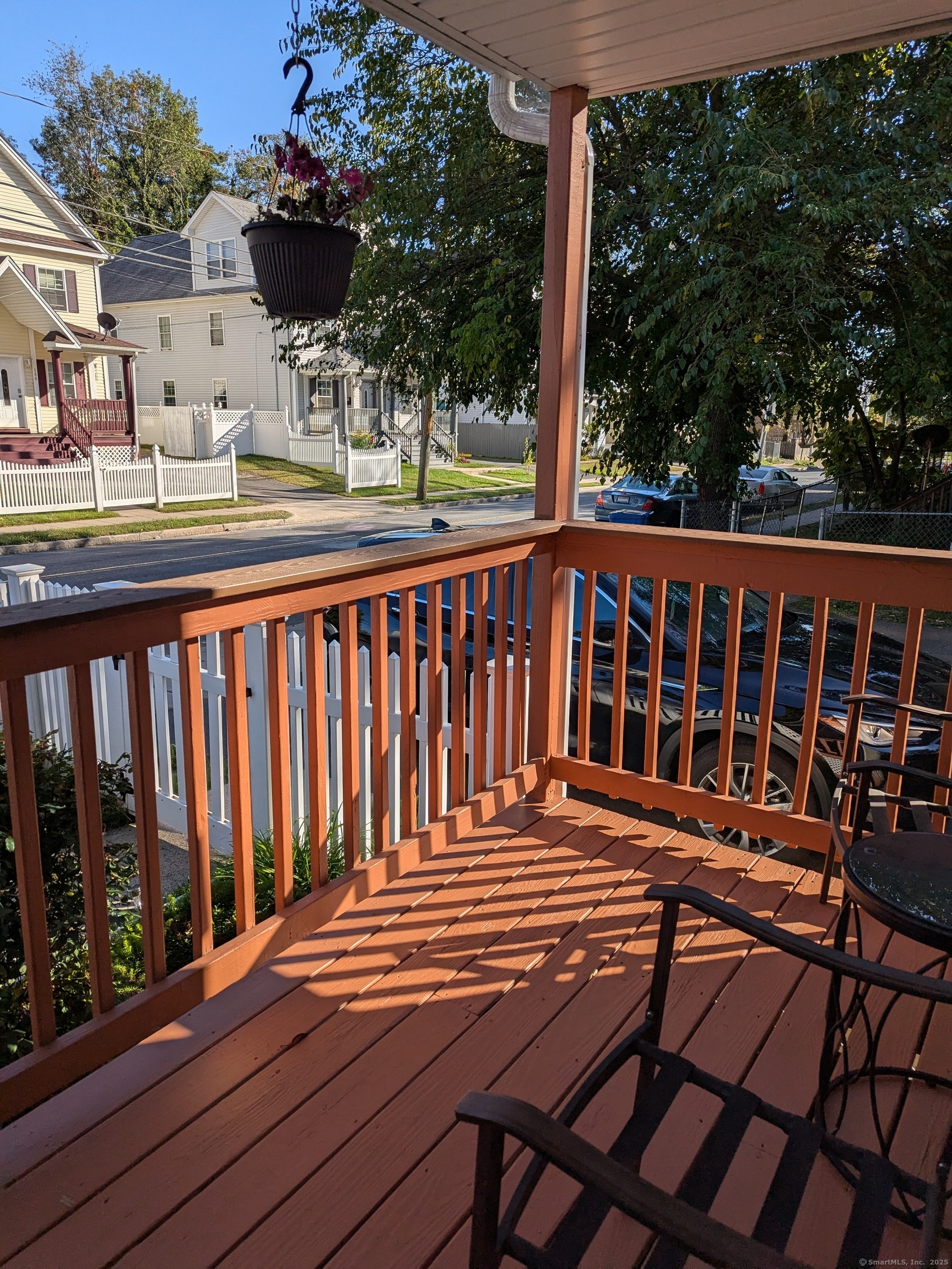 151 Enfield Street Hartford, CT 06112 - Photo 11 of 35 a view of a chairs on wooden deck
