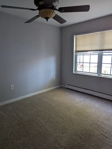 an empty room with a empty space and windows