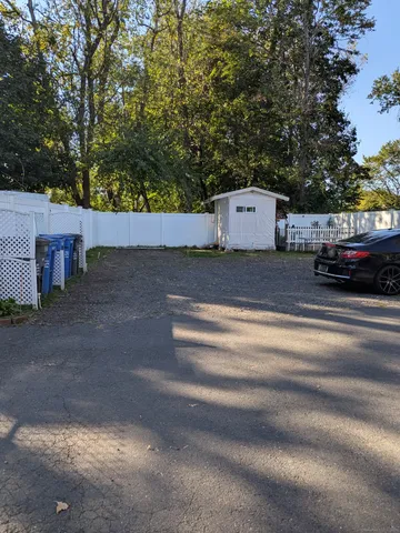 a view of a car in front of a house