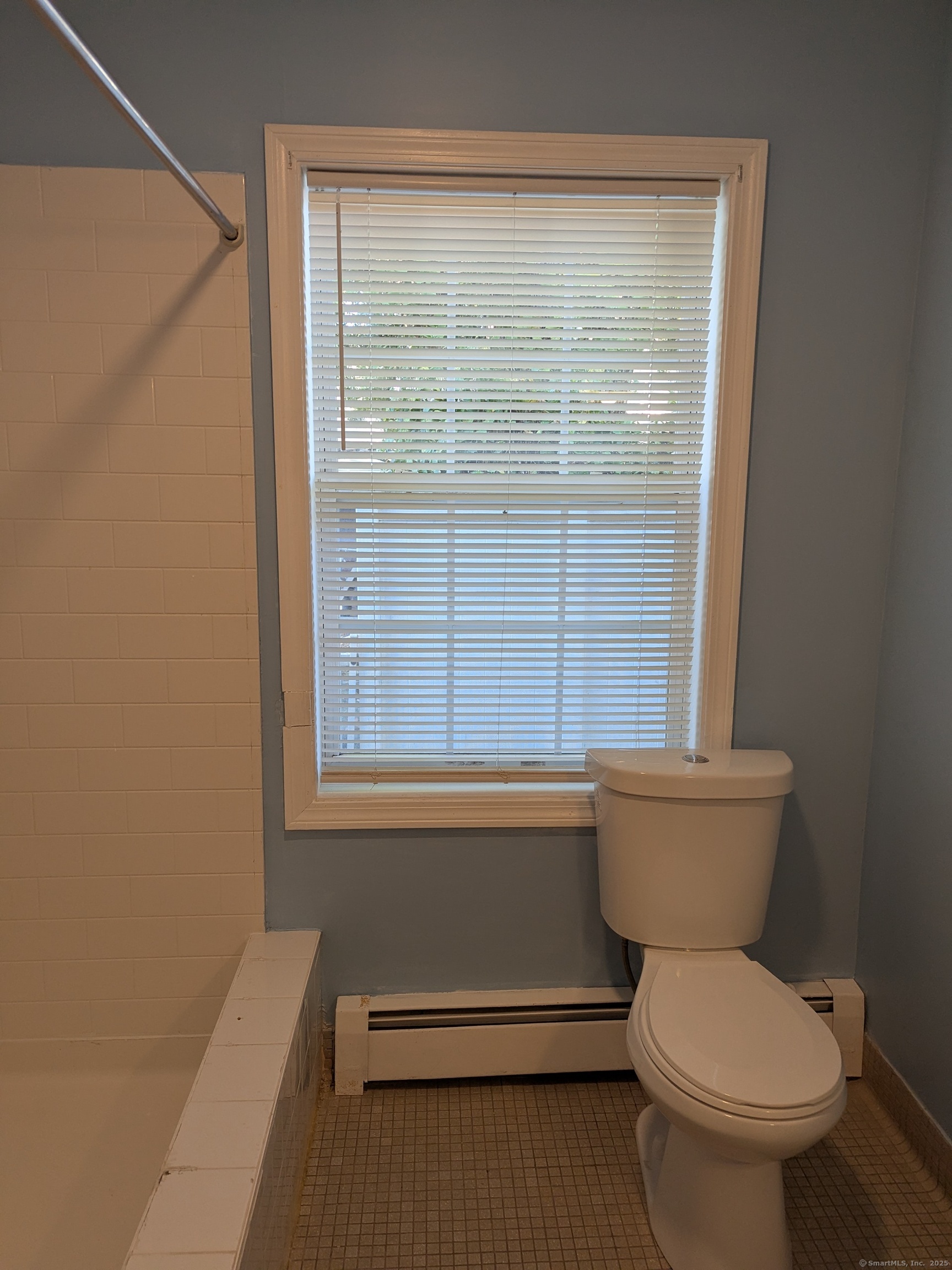 151 Enfield Street Hartford, CT 06112 - Photo 21 of 35 a bathroom with a toilet a sink and a window