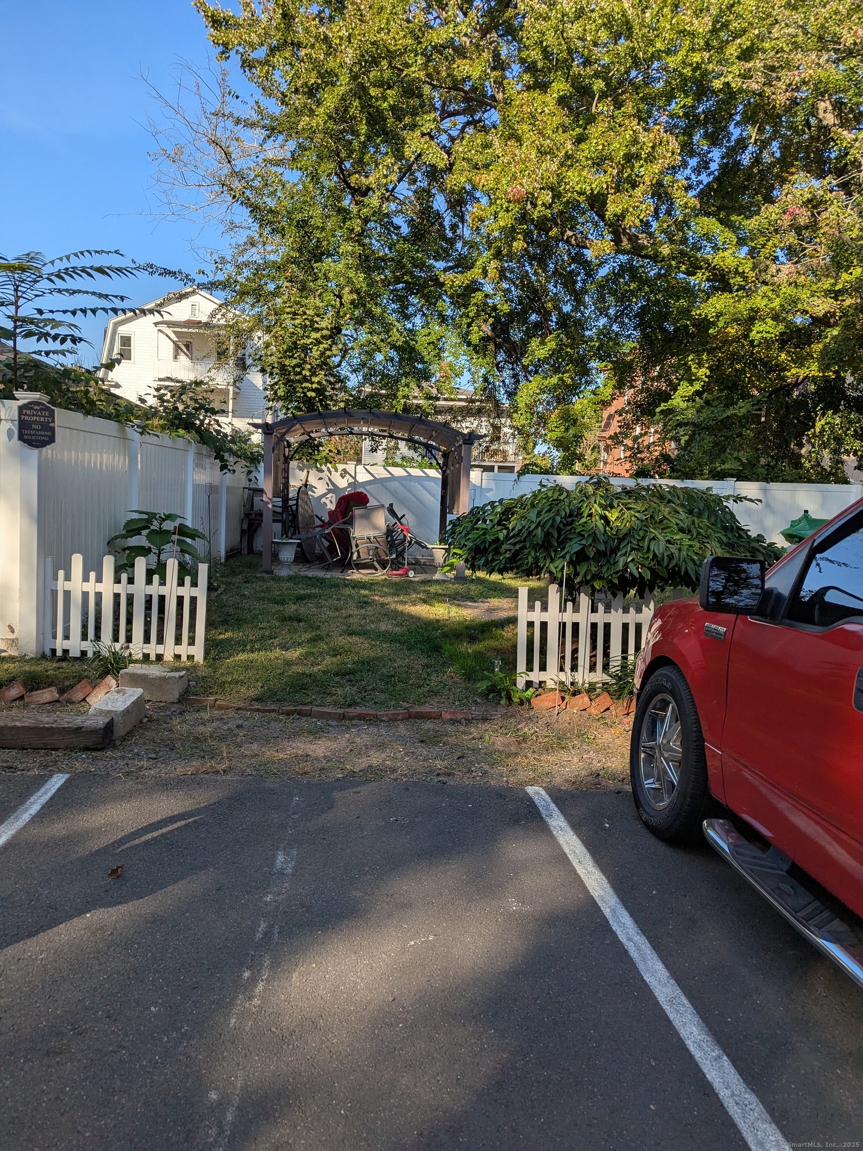 151 Enfield Street Hartford, CT 06112 - Photo 3 of 35 a car parked in front of a house