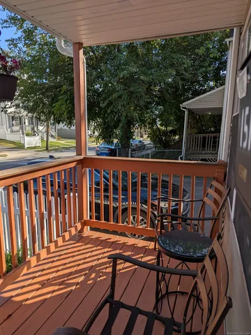 a view of a two chairs and table in the balcony