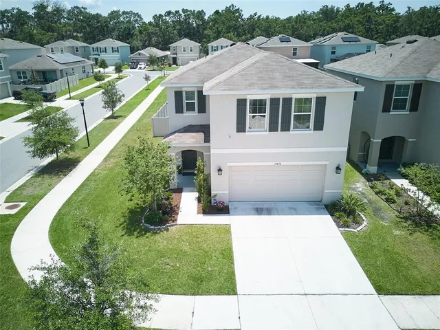 a aerial view of a house with swimming pool