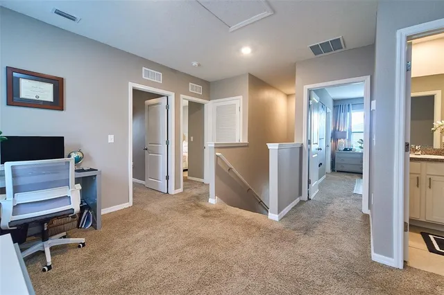 a spacious bedroom with a bed and a couch