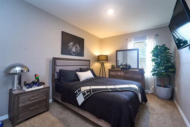 a bedroom with a bed and window