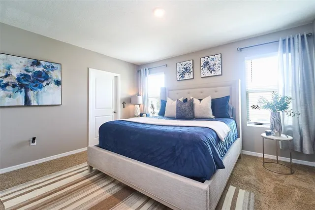 a bathroom with a shower and a glass door