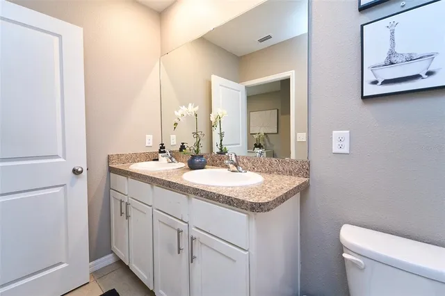a view of a patio with table and chairs and potted plants