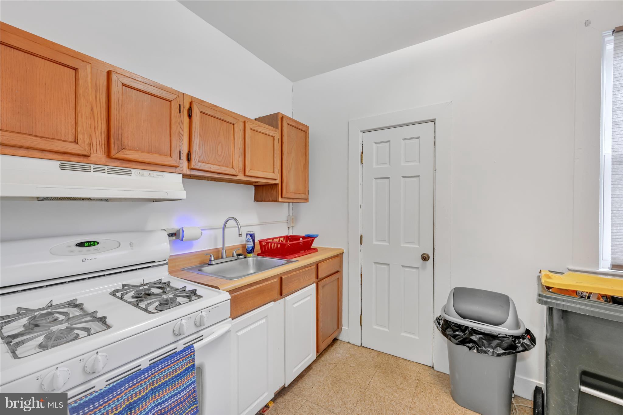 153 North Broad Street Lancaster, PA 17602 - Photo 19 of 38 a kitchen with a stove and a refrigerator