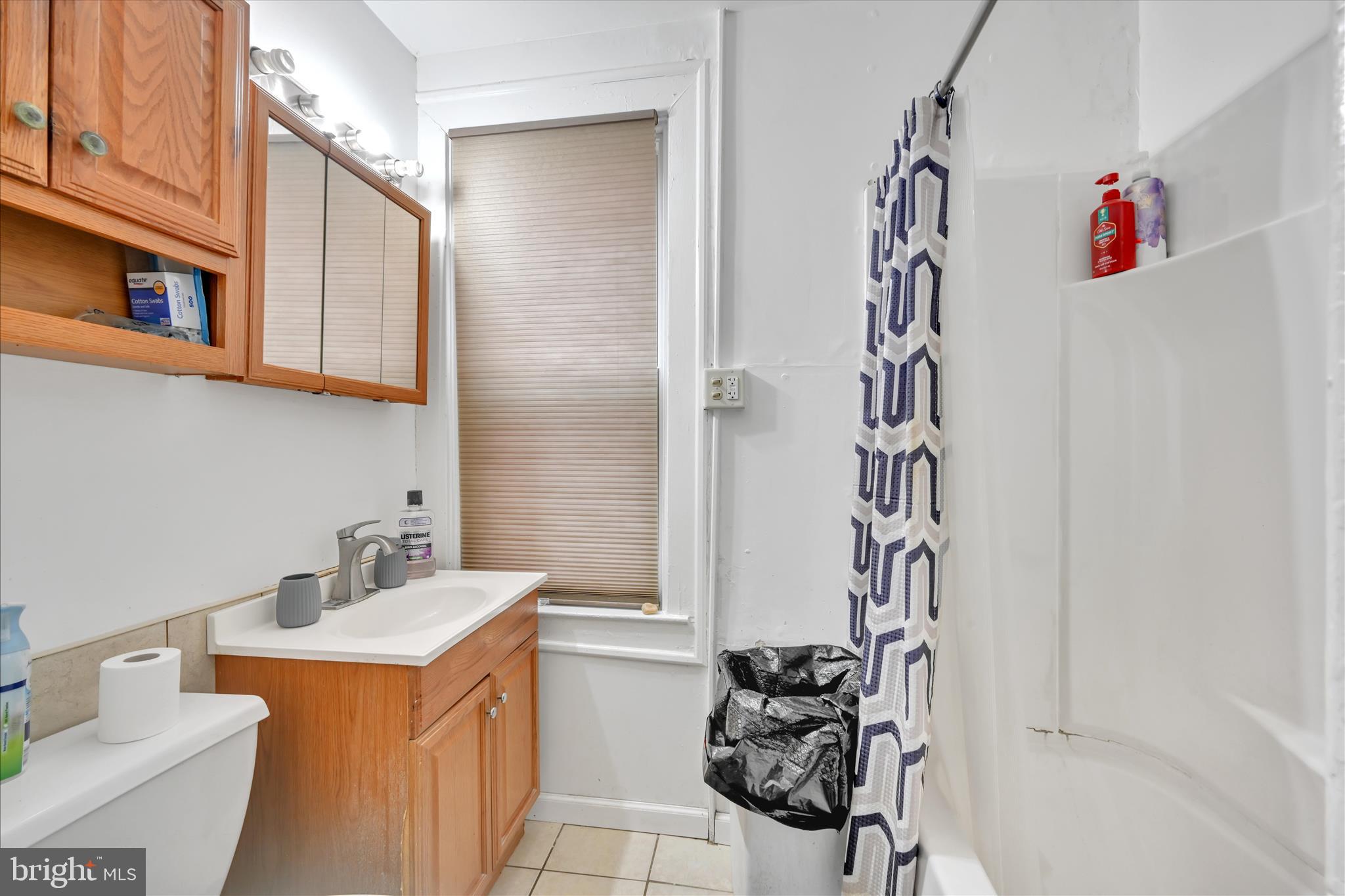 153 North Broad Street Lancaster, PA 17602 - Photo 22 of 38 a bathroom with a sink and a mirror