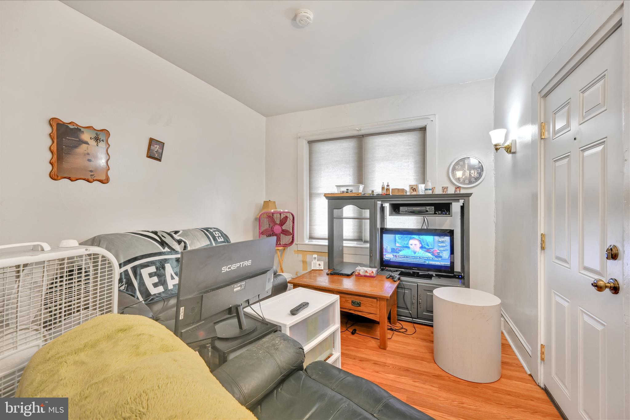 153 North Broad Street Lancaster, PA 17602 - Photo 23 of 38 a living room with furniture and a fireplace