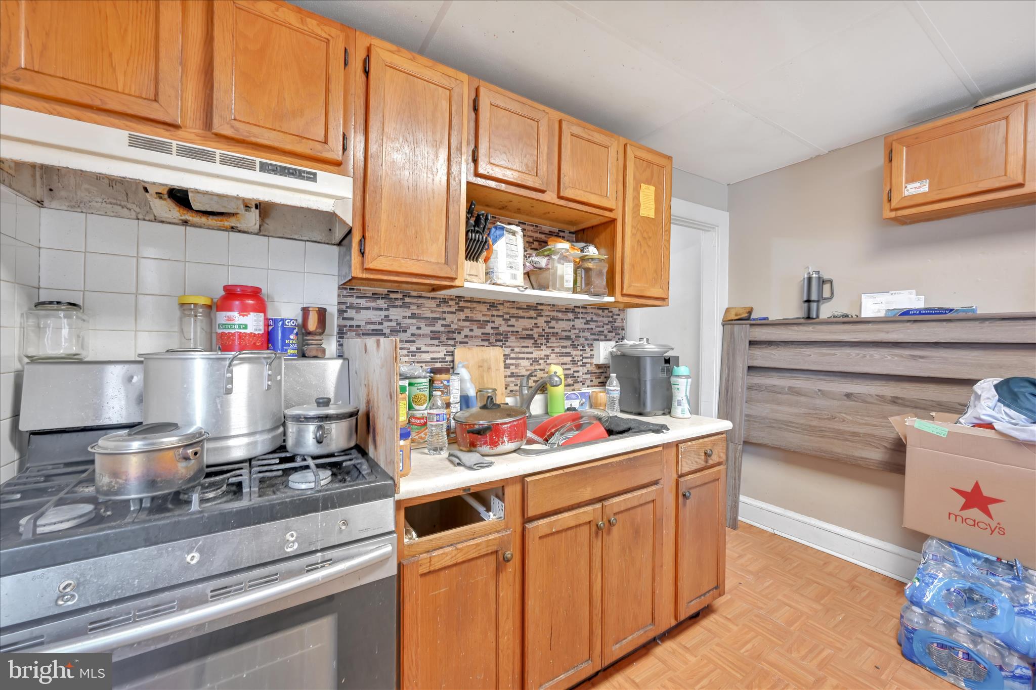 153 North Broad Street Lancaster, PA 17602 - Photo 28 of 38 a kitchen with stainless steel appliances granite countertop a sink dishwasher and cabinets with wooden floor